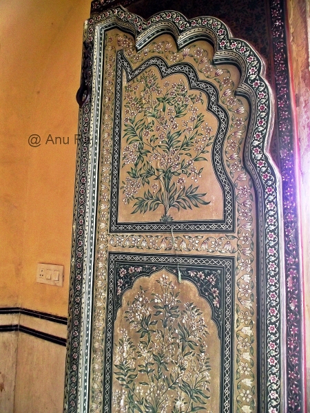 A beautiful door with fresco and other design elements